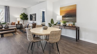 Dining area featuring dark hardwood / wood-style f
