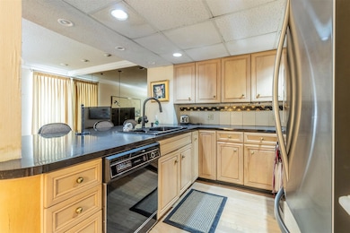 Kitchen with updated appliances and a breakfast ba