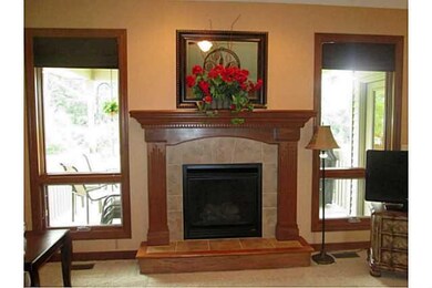 Exterior Front. Gas fireplace flanked by Marvin wi