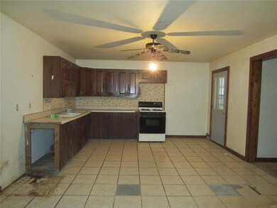 Spacious kitchen which leads to back deck/ side en