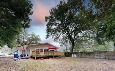 front view w beautiful trees in front and backyard