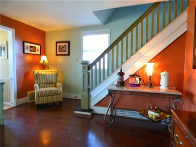 spacious living room with beautiful open staircase