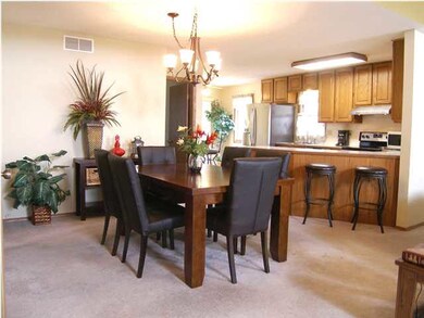 Overview of dining and kitchen taken from entry fo