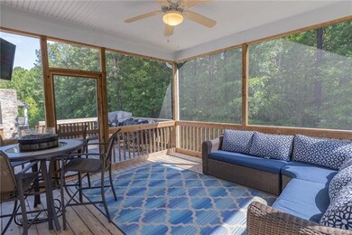 Enjoy spending time on the screened-in back porch with t.v. connection and lighted ceiling fan.
