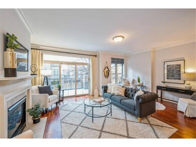 Living room with sliding glass door that leads to 