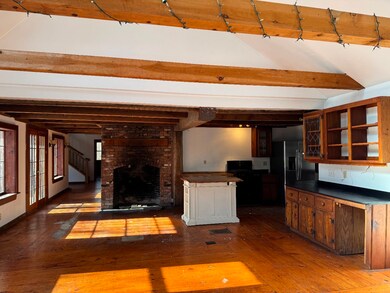 Family room and dining room with fireplace