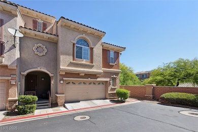 Mediterranean / spanish home with stucco siding, a garage, and driveway