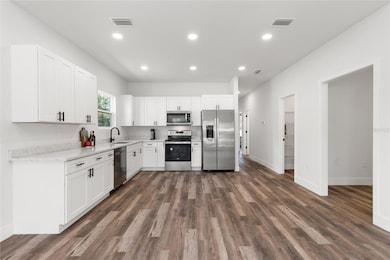 Kitchen with stainless-steel appliances
