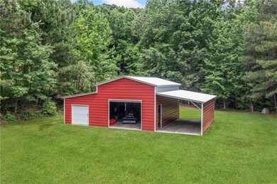 permitted Max Steel barn with concreter floor.  Has water and potential for electric