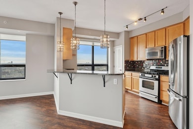 Spacious kitchen with added pantry, maple cabinets, updated appliances and breakfast bar.