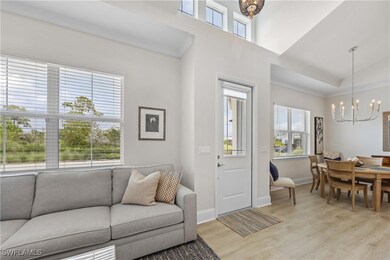 Living room with light hardwood / wood-style floor