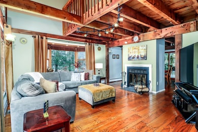 Bowed window, fireplace, hardwood floors