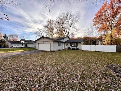 View of front of house with driveway and a garage
