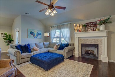 Large living room with updated fireplace and wood 