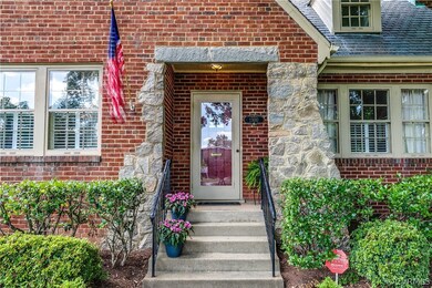 Covered entryway with glass storm door leads you into this lovely home.