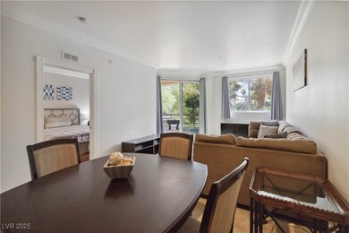 Dining area featuring ornamental molding and light