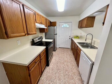 Kitchen featuring range with electric stovetop, d