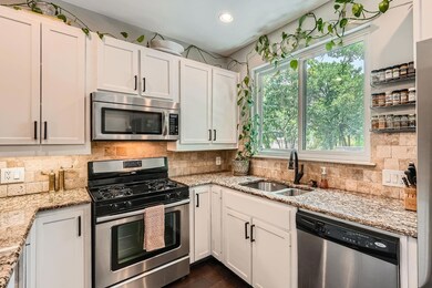Kitchen with stainless steel appliances, a sink, 