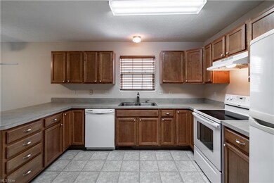 Eat-in kitchen with plenty of cabinets and counter