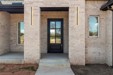 Entrance to property with brick siding
