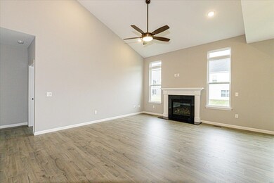 Great Room with 2 Story Vaulted Ceiling and Gas Fi