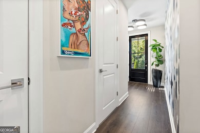 Powder Room and Coat Closet tucked away in Hall for privacy