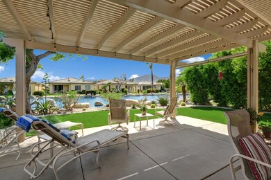 BACK TRELISSED LOUNGING PATIO TO LAKE