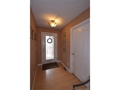 Foyer features a leaded glass door.