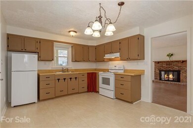 Kitchen includes space for a small dining area.