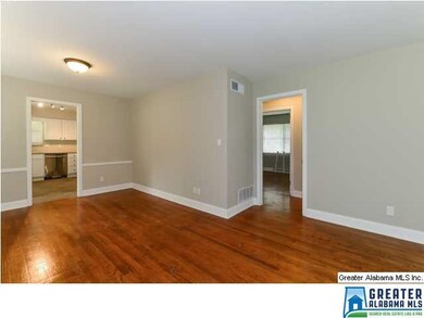 Gleaming Hardwoods run throughout the house