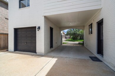 Secure and stylish, the gated porte-cochère offers