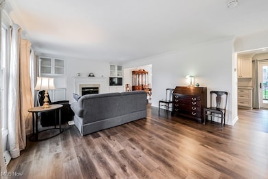 With fireplace, built ins and lots of windows.