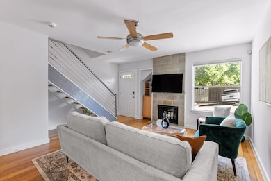 Living area featuring light wood-type flooring, b