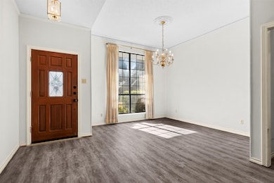 As your enter the home, the formal dining room welcomes you with a huge window providing abundant natural light.