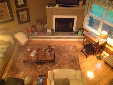 VIEW OF LIVING ROOM FROM UPSTAIRS LOFT