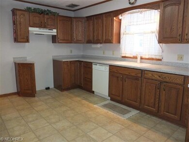 Updated kitchen with solid surface countertops.