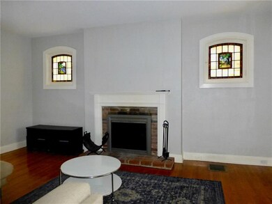 Living room, fireplace, stained glass windows