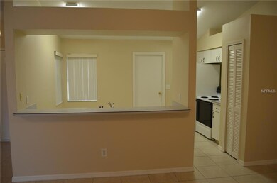 Plenty of room for bar stools at this breakfast bar.  Closet pantry to the right.  Door straight ahead leads to 2 car garage.