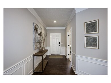 Wide open foyer with wainscoting