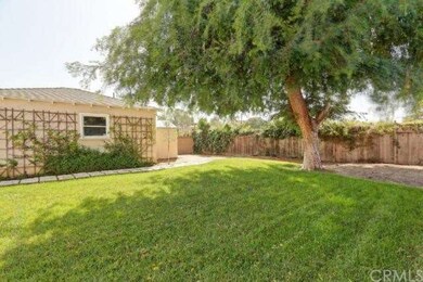 Fabulous back yard under the shade of a pepper tre