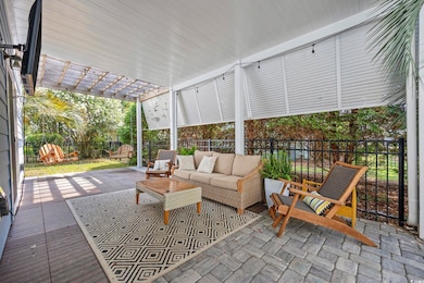 Fenced backyard with outdoor lounge area