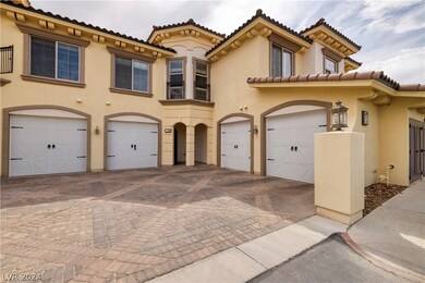 Entrance and 1 car garage at 17 Via Visione Unit 1