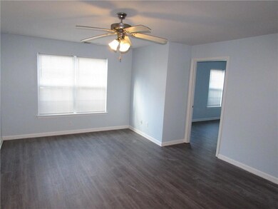 Unfurnished room with dark wood-style flooring, ce