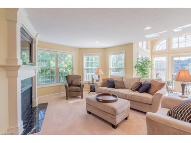 Living room, with gas fireplace, has expansive vie