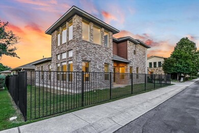 Property exterior at dusk featuring brick siding