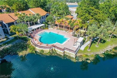 Bird's eye view of a pool area and a nearby body of water