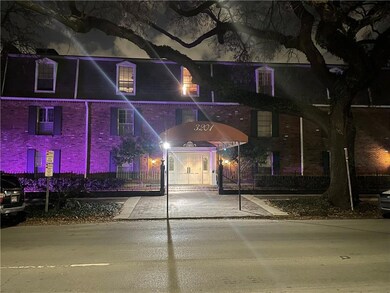 Front entrance of building along St Charles Ave.