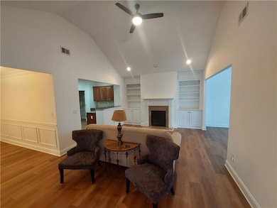 Living area featuring wood finished floors, built 