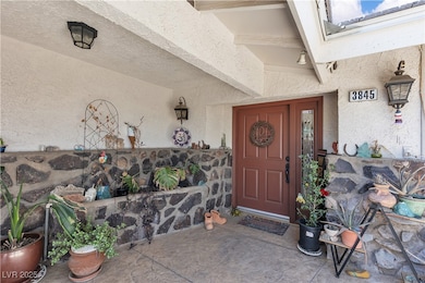Property entrance with stucco siding