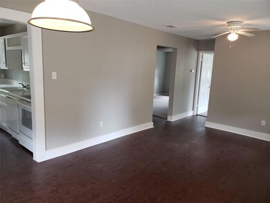 Spare room featuring dark hardwood / wood-style fl